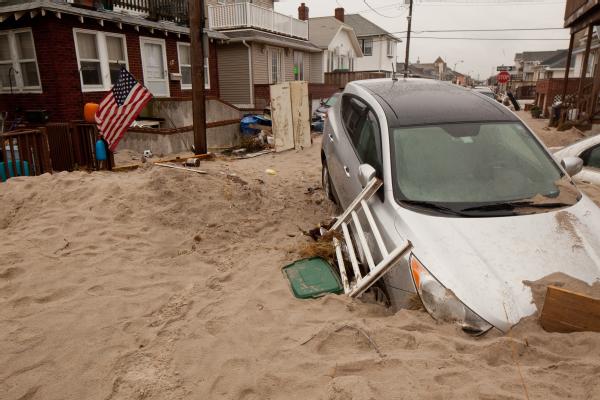 Long Beach, N.Y., Nov. 7, 2012 -- Cars were buried in sand from Hurricane Sandy. The storm surge created widespread flooding, power outages and devastation on Long Beach, New York. FEMA is working with state and local officials to assist residents who were affected by Hurricane Sandy.