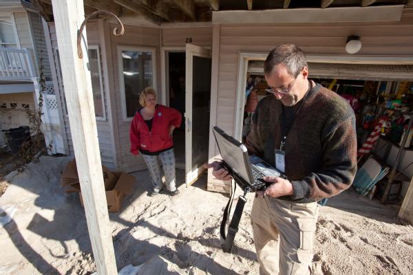 Long Beach, N.Y., Nov. 9, 2012 -- FEMA Housing Inspector, Bill Gay inspects a home in Long Beach for Hurricane Sandy related damages. The FEMA Individual Assistance program provides financial assistance for temporary housing and minor housing repairs.