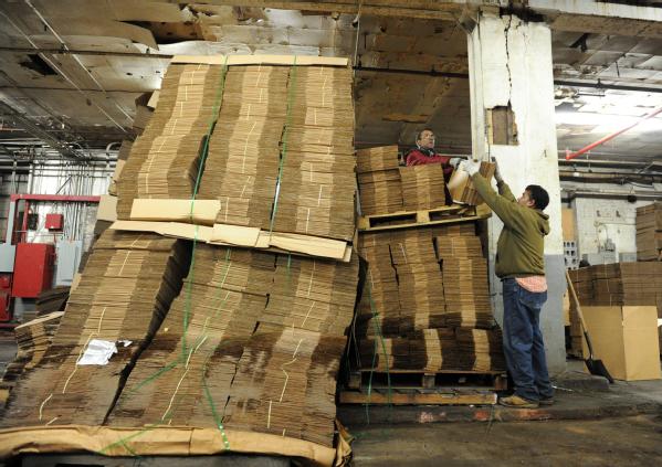 Brooklyn, N.Y., Dec. 4, 2012 -- Workers at local Red Hook business Cornell Paper and Box Company, continue cleanup of boxes inside the warehouse that was flooded during Hurricane Sandy. Business impacted by the storm may contact the Small Business Administration (SBA) for low-interest disaster loans at all New York State/FEMA disaster recovery centers and 18 SBA business recovery centers. 